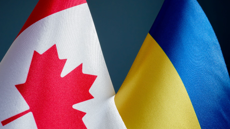 Close up of flags of Canada and Ukraine.